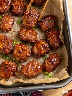 the meatballs are ready to be served in the pan with toothpicks on them