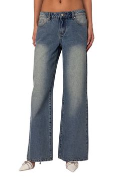 These Y2K-inspired nonstretch jeans sit low on the waist and flare into floor-sweeping wide legs, creating a trendy look that can be styled up or down. Zip fly with button closure Five-pocket style 100% cotton Machine wash, dry flat Imported Distressed Washed Blue Bottoms For Fall, Mid-rise Washed Blue Pants With Frayed Hem, Distressed Washed Blue Pants For Fall, Fall Distressed Washed Blue Pants, Mid-rise Distressed Washed Blue Bottoms, Distressed Washed Blue Mid-rise Bottoms, Washed Blue Wide Leg Distressed Bottoms, Distressed Washed Blue Wide Leg Bottoms, Washed Blue Distressed Wide Leg Bottoms