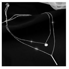 This Sterling Silver necklace comes with a cubic zirconia pave set charm on the shorter silver chain and a silver bar hanging from the longer silver chain. A beautiful accessory for a night out and perfect as a gift.  Our sterling silver layer necklace comes in stylish white gift box, ideal for gifting and with FREE delivery worldwide.   Features - 925 Silver Layered Necklace - Crystal set charm - Silver solid bar - Extension chain  - FREE Delivery Worldwide  - Gift wrapping available Returns & Silver Dangle Jewelry For Birthday Gift, Silver Minimalist Necklace As Gift, Silver Clavicle Chain Necklace Birthday Gift, Silver Clavicle Chain Necklace As Birthday Gift, Silver Clavicle Chain Necklace For Birthday, Minimalist Silver Necklace For Birthday, Elegant Silver Jewelry For Birthday Gift, Silver Minimalist Jewelry For Birthday, Silver Minimalist Jewelry For Birthday Gift