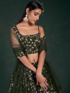 <ul>
<li style="text-align: justify;">Be the sunshine of everyone's eyes dressed in this olive green color lehenga crafted with georgette material accomplished with sequins work and zari work.</li>
<li style="text-align: justify;">This olive green lehenga arrives with a similar color choli made with georgette material designed with sequins work and zari work. It also arrives with a similar color soft net material dupatta completed with a sequins work and zari work.</li Ghaghra Choli, Georgette Material, Bridesmaid Lehenga, Women Marriage, Georgette Lehenga, Party Wear Lehenga Choli, Sequin Bridesmaid, Lengha Choli, Green Lehenga