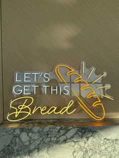 there is a sign that says let's get this bread