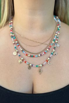 This necklace features 5 different layers that all compliment each other beautifully. Three of the layers are thin uniquely shaped gold chains, and the other two layers are beaded with beautiful multi colored beads. The longest beaded layer also features 7 dainty gold charms. Length: 9" with 2.5" extender. Beeded Necklace, Obx Outfits, Layered Beaded Necklace, Layered Beaded Necklaces, Gold Charms, Mini Pendants, Just Girly Things, Gold Charm, Girly Things