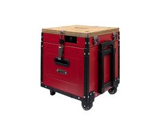 a red and black cart with wheels on it's sides, holding a wooden box