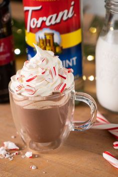 hot chocolate drink with whipped cream and candy canes