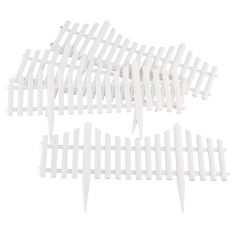 four white plastic pickets are stacked on top of each other in the shape of an arrow