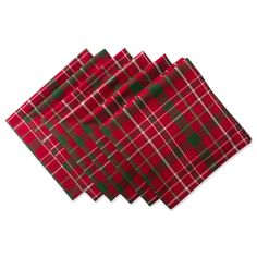 four red and green plaid napkins sitting on top of each other