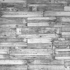 an old wood paneled wall is shown in this black and white photo, with the grain