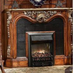 an ornate fireplace with a clock on the mantle