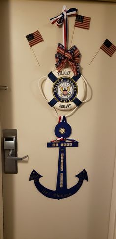 the door is decorated with an anchor, ribbon, and marine seal on it's side