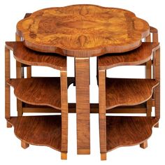 a wooden table with three tiered shelves on each side and an oval shaped top