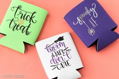 three different colored paper can coolers on a pink background with the words trick or treat printed on them