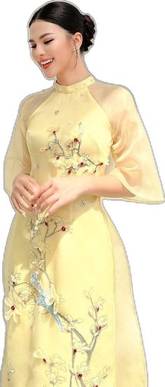 Spring Floral Embroidered Fitted Gown, Elegant Embroidered Cheongsam For Spring, Festive Organza Dress With Floral Applique, Spring Embroidered Silk Gown, Elegant Spring Ceremony Gown, Festive Floral Applique Organza Dress, Spring Banquet Gown With Floral Applique, Elegant Embroidered Ao Dai For Summer, Floor-length Dress For Spring Ceremonies