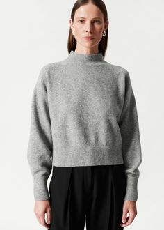 Mock-neck knit sweater with dropped shoulders and a straight silhouette. • Ribbed neckline, cuffs and hem Length of sweater: 50cm / 19.7” (Size S) Swimwear Shorts, Skirt And Blouse, Ribbed Neckline, Mock Neck Sweater, Clothing Essentials, Short Jacket, Fashion Story, Grey Sweater, Mock Neck