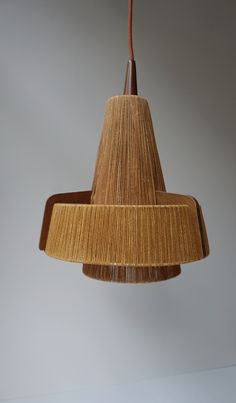 a wooden light fixture hanging from a ceiling