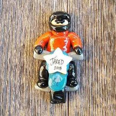 a ceramic figurine of a person on a motorbike holding a star