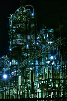 an oil refinery lit up at night time