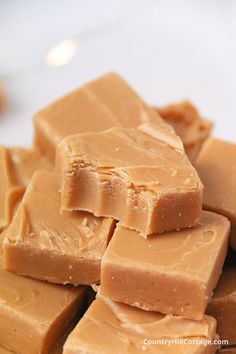 a pile of peanut butter fudges sitting on top of a white plate