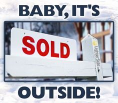 a sign that says baby, it's sold outside in front of some snow