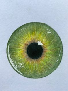 a drawing of an eye with green and yellow iris