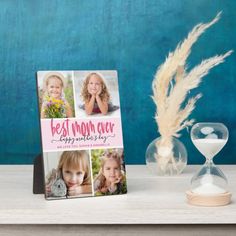 a photo frame sitting on top of a table next to an hourglass and sand timer