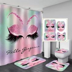 a bathroom with pink and green designs on the shower curtain, rugs and toilet