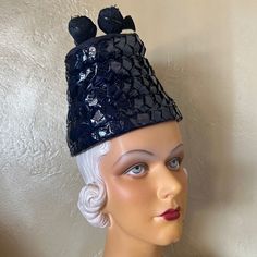 This Hat Is Visually Stunning, And Exemplifies The High Fashions Of The 1930s'. The Shiny, Wide Bands Of Straw Creatively Shape The Hat Into A Cone. There Is A Gap At The Top Back That Is Filled With Draped Navy Fabric. At The Top There Is A Grosgrain Bow That Secures 3 Small Balls Made Of Curled Navy Feathers. The Inside Of The Hat Is Lined With A Black Fabric.There Is An Elastic Band Attached To The Inside To Keep The Hat In A Tilted Position. This Hat Is Truly Remarkable, And One-Of-A-Kind! W Conical Hat, 1930s Hats, Pom Pon, Navy Fabric, Wide Bands, Fashion History, Hats Vintage, Black Fabric, Elastic Band