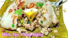 a close up of food on a wooden cutting board with a spoon in it and the words men tan trong mieng