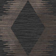 a black and brown rug with an abstract design