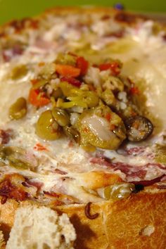 a close up of a pizza with cheese and toppings