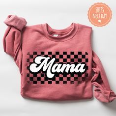 If you're looking for a thoughtful and practical gift, our apparel is sure to be appreciated by anyone who receives it. These retro mama sweatshirts are handmade to order on an ultra-soft crewneck that will quickly become your go-to apparel item! Our trendy checkered mama hoodies are made with eco-friendly water-based ink that feels good and lasts longer! You will never want to take it off! ♥Sizing info♥ *Unisex sizing. *Order your true size for a more fitted feel. Size up for a slouchier look ♥ Cute Gifts For Mom, Dtf Shirts, Cricut Explore Projects, Mama Sweater, Mama Hoodie, Mom Hoodies, Overland Park, Mama Sweatshirt, Practical Gifts