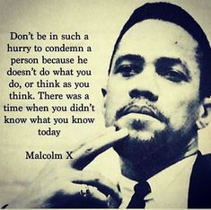 a man in a suit and tie is holding his finger to his lips with a quote from malcolm x on it