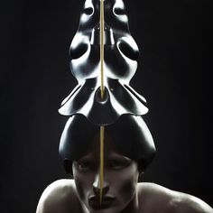 a woman with her head in the shape of a stack of knives on top of her head