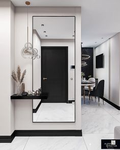 the interior of a modern home with black and white accents, marble flooring and walls