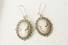 Victorian  cameo earrings. This lovely yet rose cameo earrings are just divine. This lovely piece of jewelry measures to fit a 25x18 inch cameo and comes with great antique toned french hook style dangle earrings. These gorgeous earrings measure 1 3/4 inches in length and would be the perfect gift for you or someone special. Cameo necklace: https://www.etsy.com/listing/460678090/victorian-cameo-necklace-personalized?ref=shop_home_active_2&pro=1&frs=1 https://www.etsy.com/listing/500220724/pink-c Victorian Earrings, Gifts Mom, Woman Jewelry, Cameo Earrings, Bronze Earrings, Cameo Jewelry, Jewelry Bridesmaid, Cameo Ring, Cameo Necklace