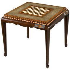 a small wooden table with a checkered tile top on the bottom, and legs