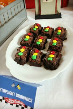 there are brownies with candy on the plate