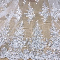 White Embroidery Sequins Lace Fabric By The Yard,Wedding Dress Mesh Fabric,DIY Handmade,For Evening Dress,Width 49 inches Fixed Width: 49 inches(125 cm) ✿Perfect for wedding dresses,evening dresses,dolls,altered art, couture, costume, party apparel, home decor and other projects you could imagine.✿ ❤If you buy more than 1 yard,it will not be cut. ❤We do not sacrifice quality for price,so you can rest assured to buy. ❤If you have any questions you can contact us at any time. More Wedding Lace Fab White Embroidered Wedding Dress For Bride, White Embroidered Lace For Wedding, White Embroidered Lace For Bride, White Lace Wedding Dress For Bride, White Lace Patchwork Wedding Dress, White Lace Tulle Fabric With Sequins, White Lace Embroidered Fabric With Sequins, White Lace Sequin Fabric With Pearl Embroidery, White Lace Tulle Fabric With Floral Applique