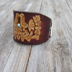 "Made from top quality Italian vegetable tanned leather. Hand painted, embossed. Cuff is 2,1 inches (5,5 cm) wideAdjustable Size approx between 15 and 18 cm Please measure carefully your wrist and select the most preferable size! If you need a diferent size, please let me know after purchase in \"note for seller\". Please visit to my another shop: https://www.etsy.com/shop/JeansBelt?ref=hdr_shop_menu FEDEX to USA and Australia! If you need a faster shipping please use this service. The delivery Handmade Western Leather Cuff Bracelet, Western Patina Cuff Bracelet Gift, Adjustable Southwestern Leather Cuff Bracelet, Southwestern Brown Leather Cuff Bracelet, Unique Wrist Watch, Rustic Hand-tooled Leather Cuff Bracelet, Mens Watches Leather, Leather Jewelry Diy, Cowgirl Bling