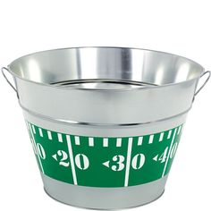 a green and white measuring tape in a metal bucket