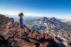 a person standing on top of a mountain