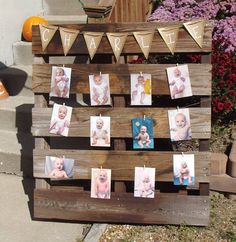 a wooden pallet with pictures hanging on it