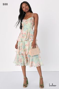 Springtime soirees just got a little sweeter now that the Lulus Darling Aesthetic Green Floral Print Tiered Midi Dress is on the scene! Airy woven organza boasts a lush floral print as it shapes adjustable spaghetti straps and a bodice with surplice-inspired seaming that gives an overlapping effect. Fitted waist sits above a skirt that falls in floaty tiers to a midi hem. Hidden zipper/clasp at back. Fit: This garment fits true to size. Length: Mid-calf length. Size medium measures 41" from adju Organza Midi Dress, Midi Dress Floral, Aesthetic Green, Lulu Fashion, Green Floral Print, Tiered Midi Dress, Green Aesthetic, Wedding Shop, Spring Time