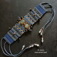 a beaded bracelet is laying on the ground