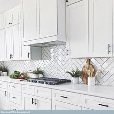 the kitchen is clean and ready for us to use it's white cabinetry