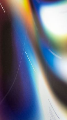 an image of the back side of a brochure with blurry colors on it