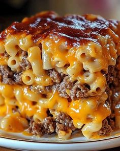 a close up of a plate of food with macaroni and cheese on it