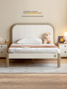 there is a teddy bear sitting on top of the bed in this child's bedroom