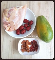 fruits, nuts and meat are on the table