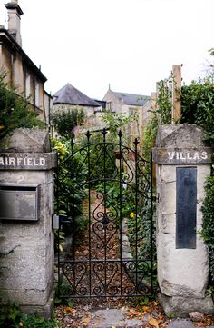 an iron gate with two heads on each side and the words airfield above it