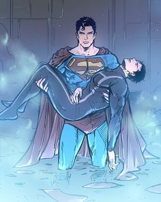 a man in a superman suit is being hugged by another man